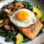 Pan-Seared Salmon with Sunny Egg, Sautéed Spinach, Mushrooms & Avocado